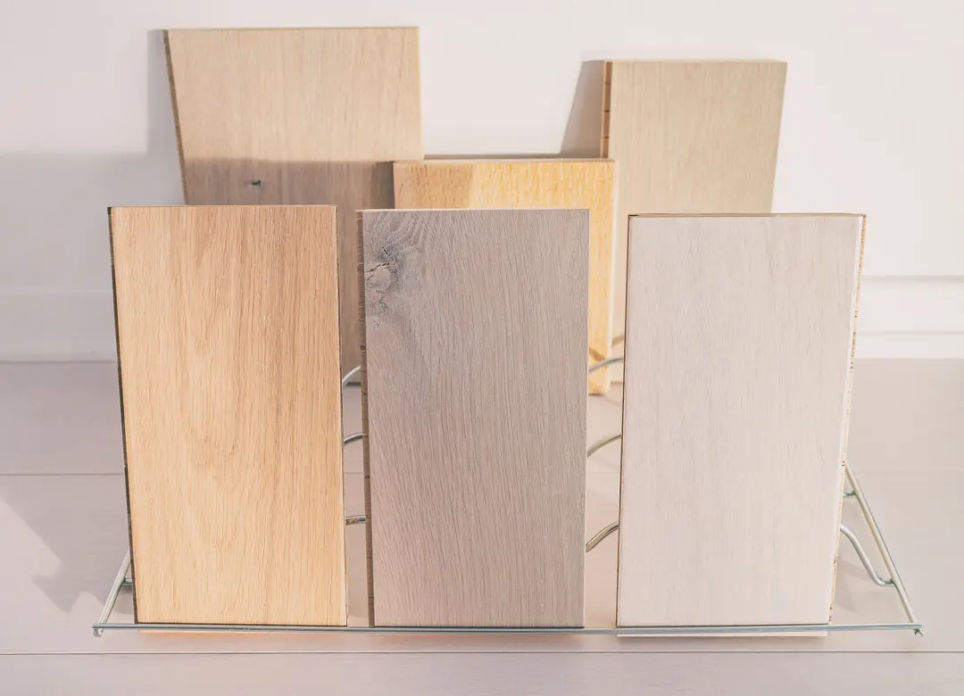 Wooden flooring samples displayed in a rack.
