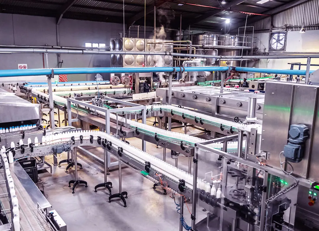 Bottling factory assembly line in operation.