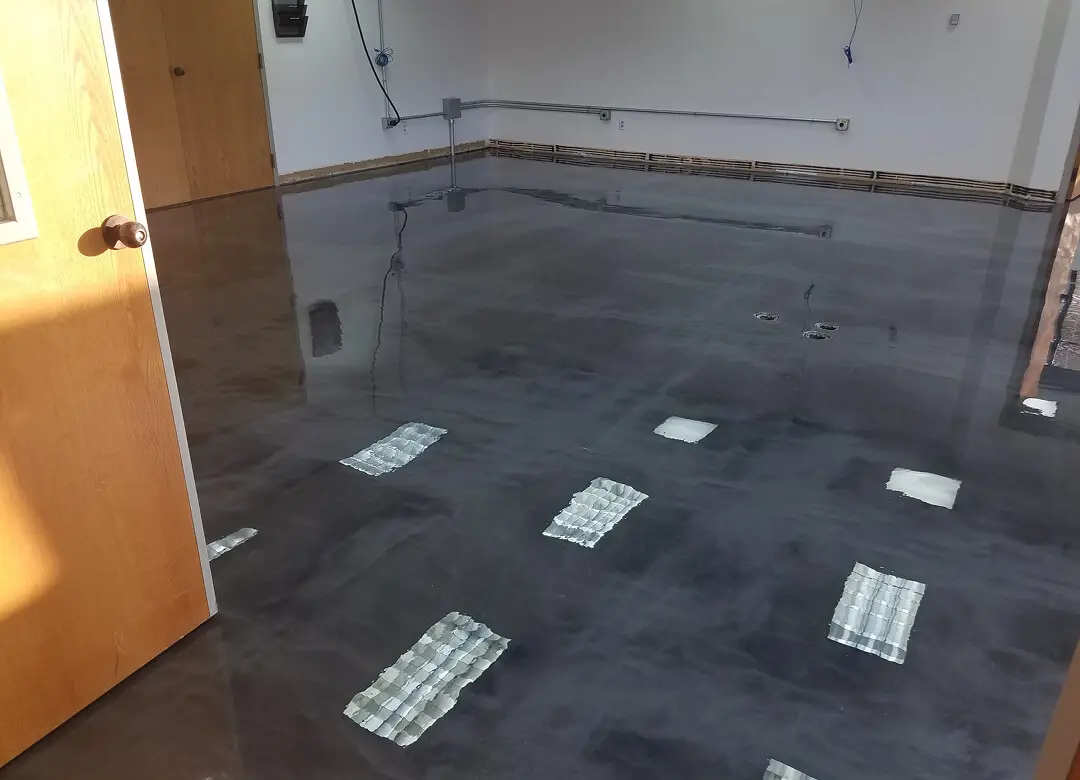 Shiny, polished concrete floor in empty room.