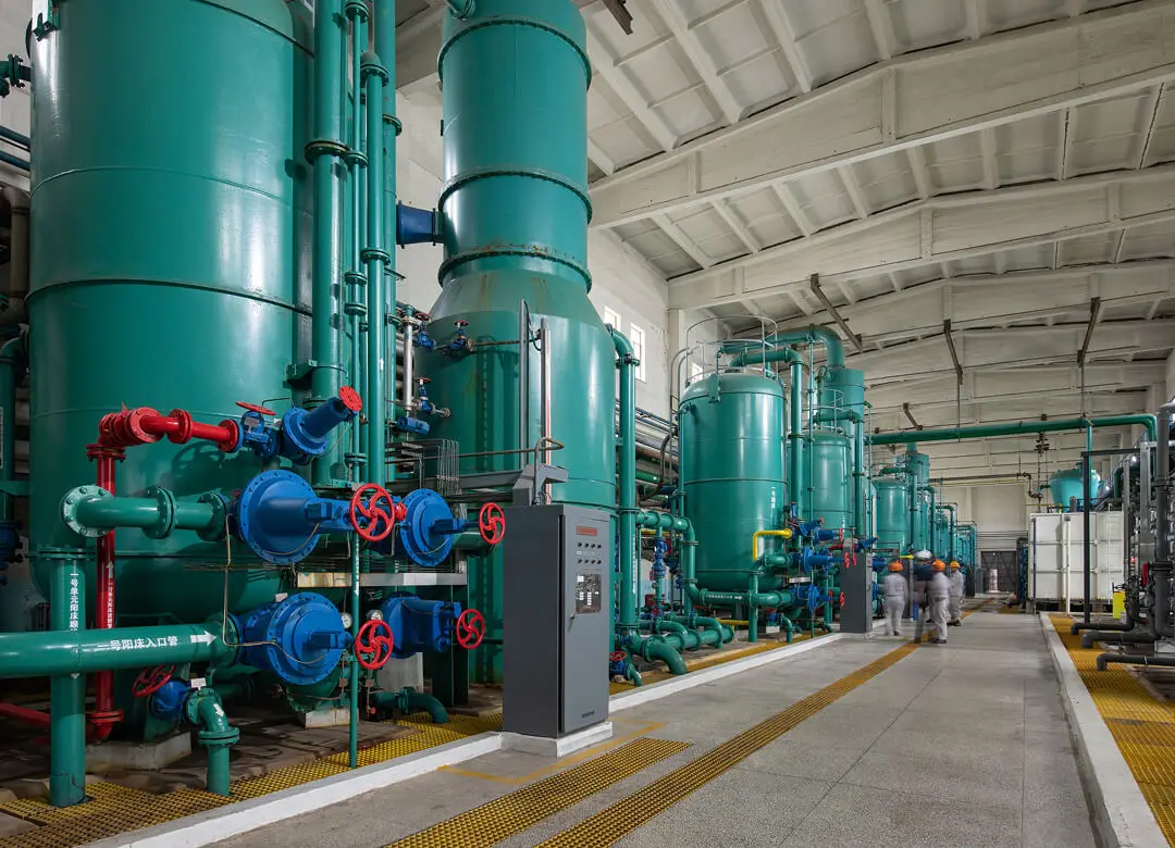 Industrial facility with large green machinery.