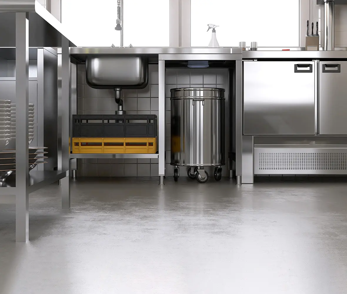 Commercial kitchen with stainless steel equipment.