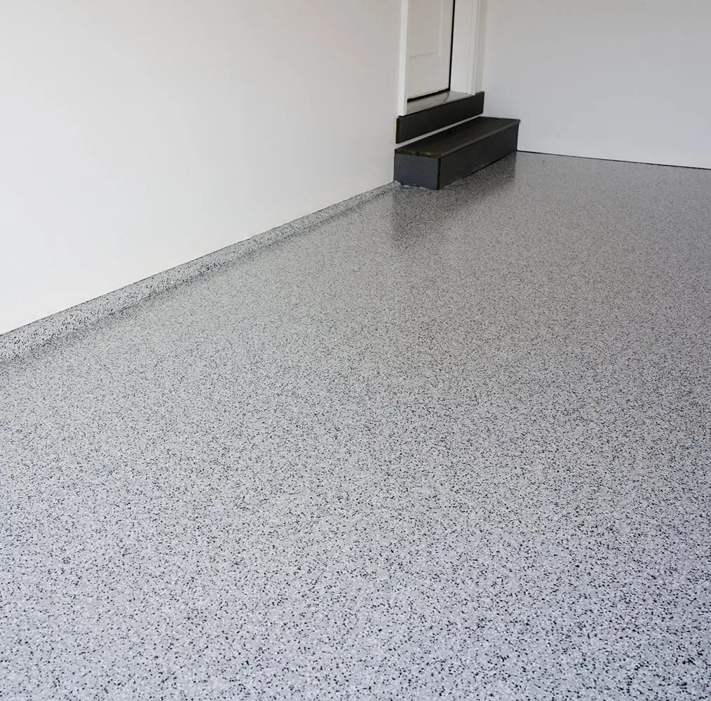 Gray speckled epoxy floor in empty room.